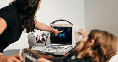 A women’s health physiotherapist carrying out a pelvic health assessment with a patient at Six Physio